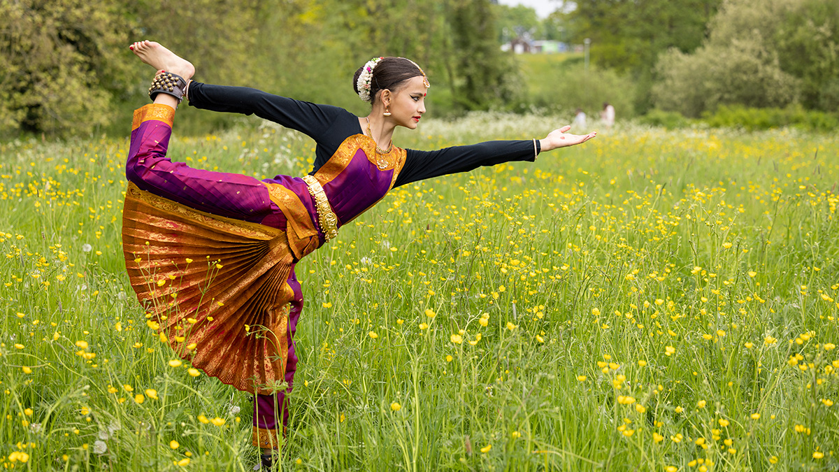 Dancer posed in a traditional Indian dance