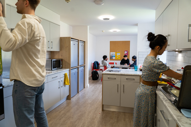 Students in communal kitchen area