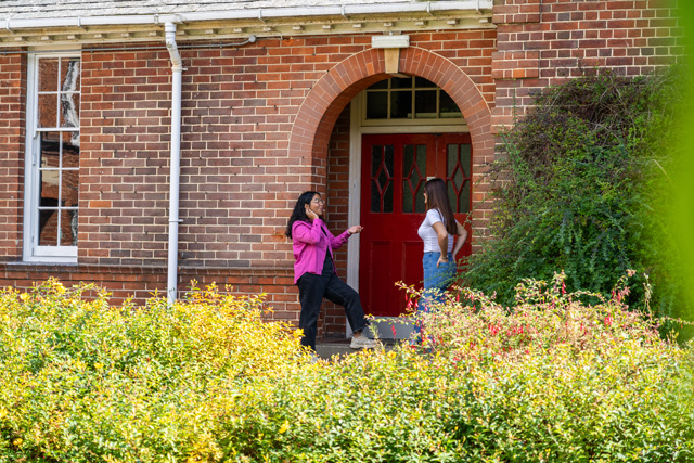 Students talking in doorway