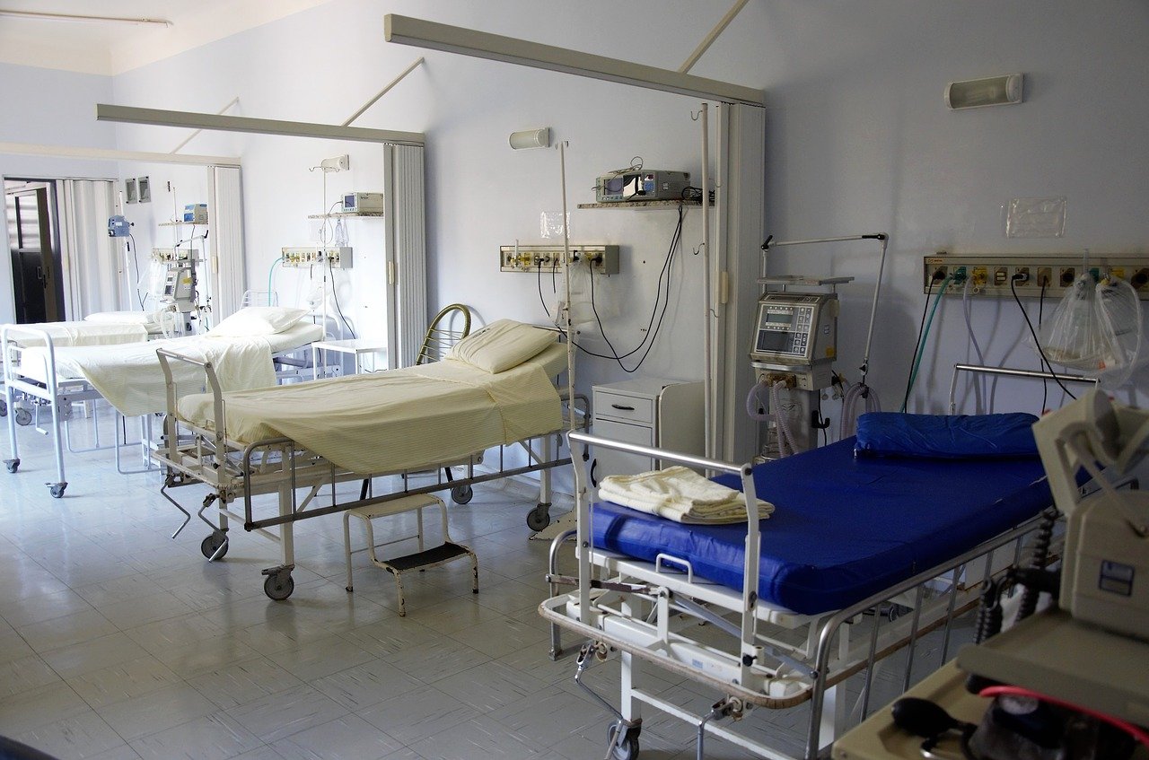 Empty hospital beds in a ward