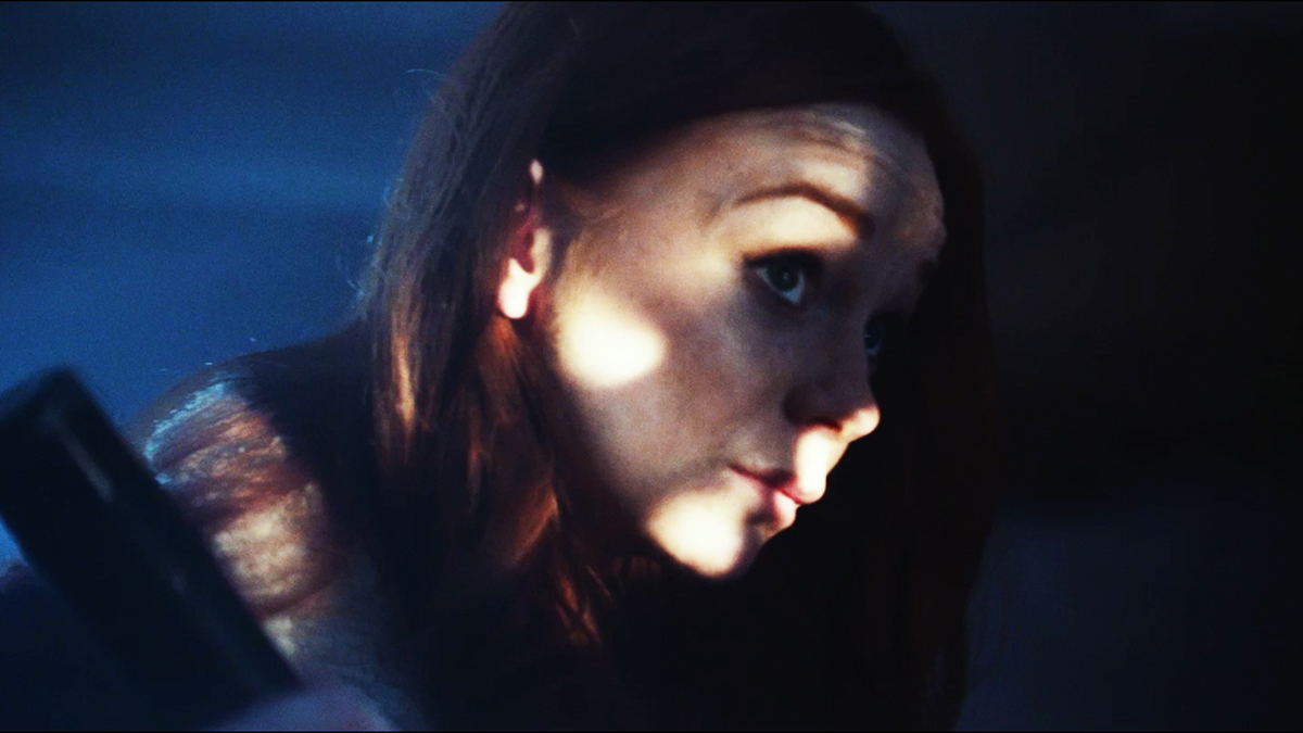 Screenshot of a student film, of a face with light