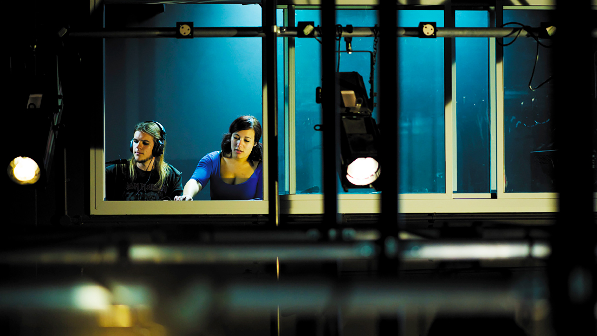 Two students in the lighting box in Bob Kaley theatre
