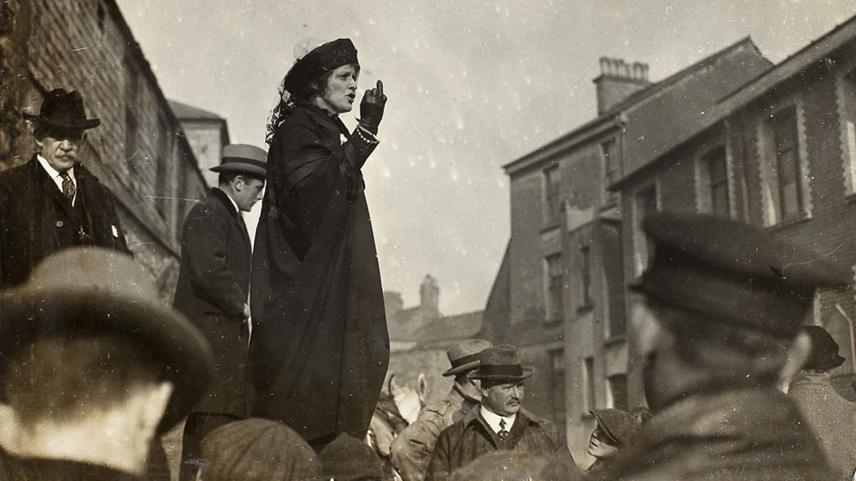 photograph of Nancy Astor waving to a crown of people