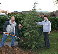 Colin Robbins, Tracy Lunn, Rob Jordon and Janis Pich planting the tree