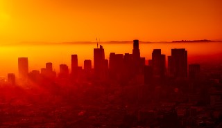 Sunrise over city smog