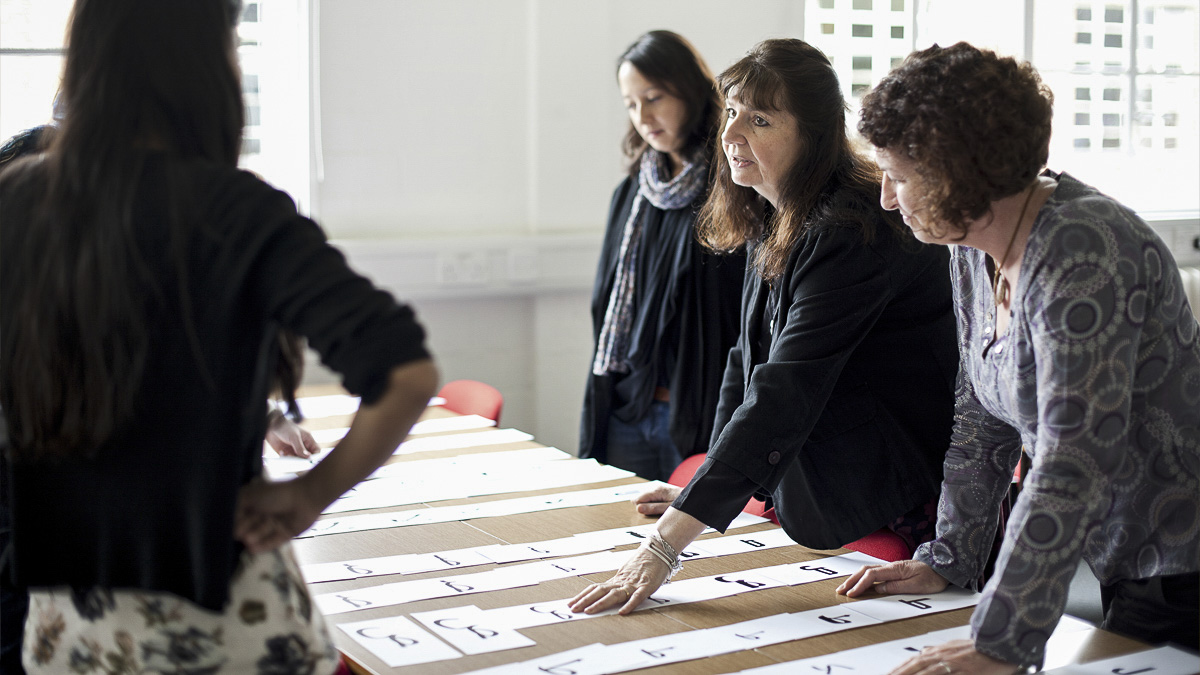 Professor teaching workshop on letterforms in Department of Typography
