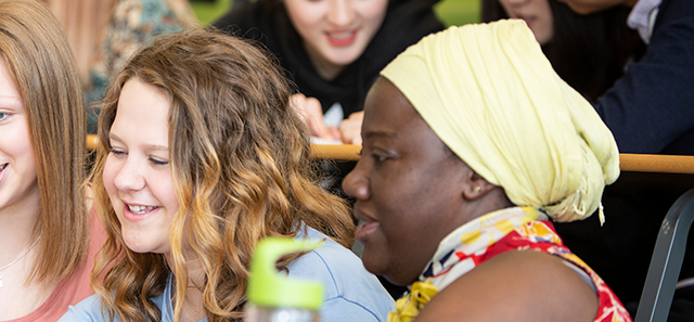 Three students reading a document