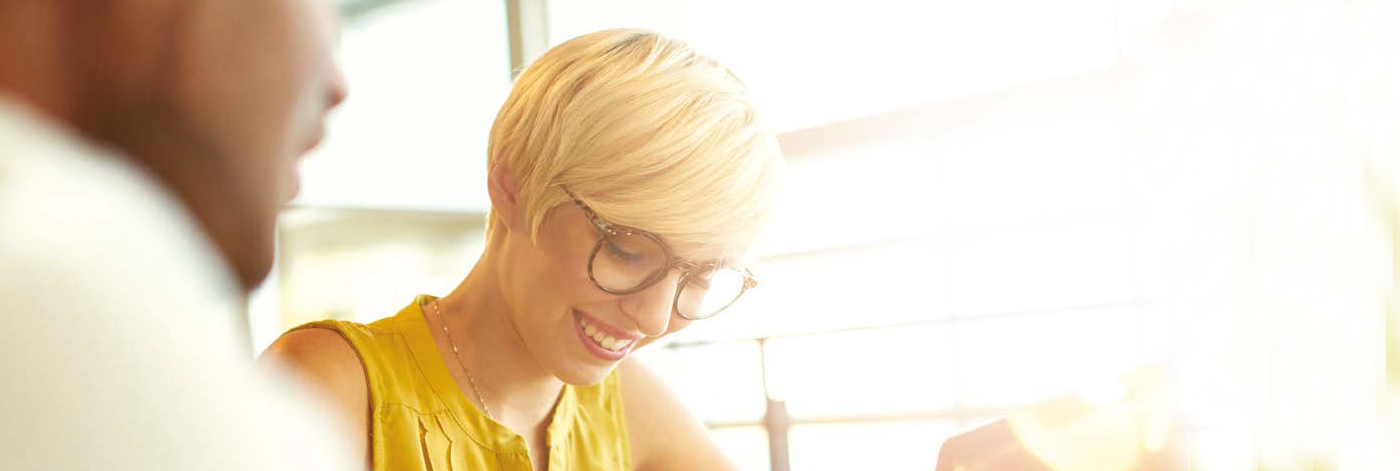 Man and woman talk whilst studying