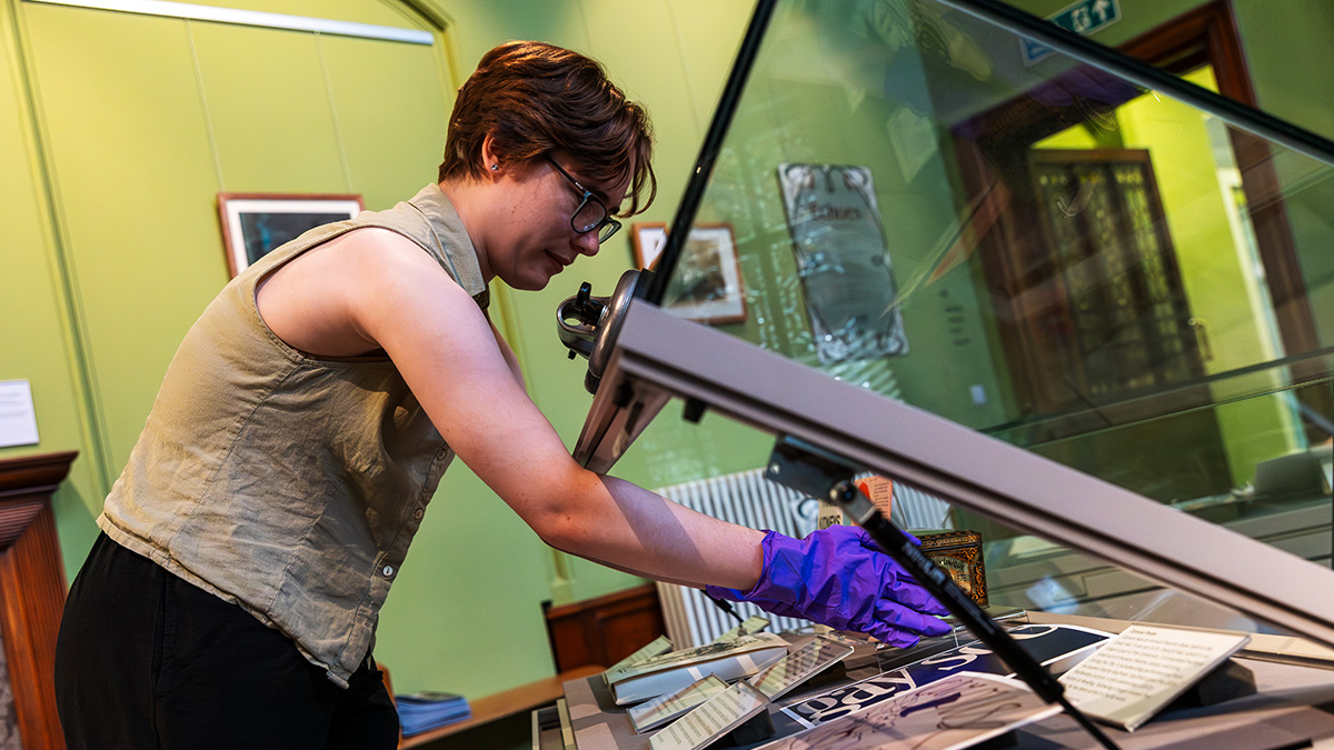 Museum curator carefully handles exhibits