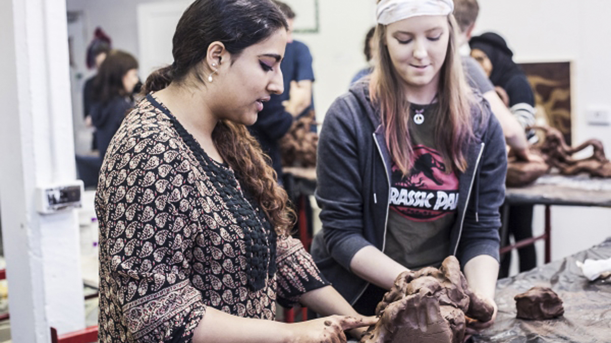 students taking part in a clay workshop