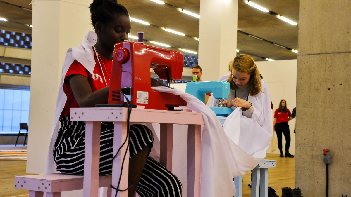 Students sewing as part of art exhibition