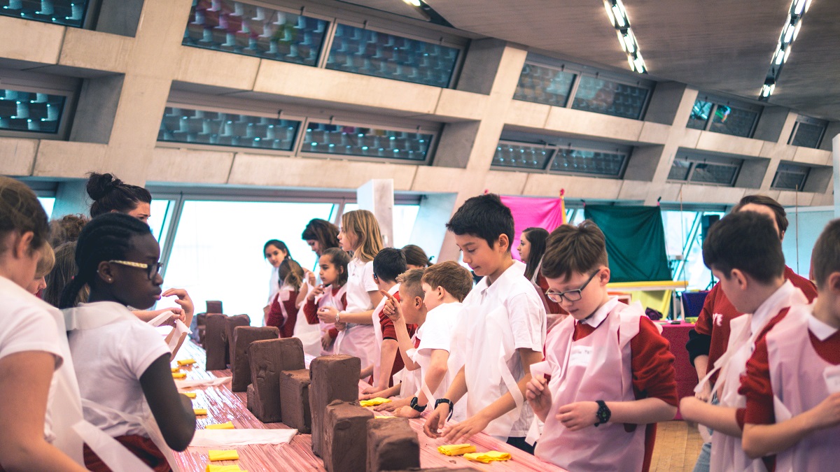 Children at the Tate Exchange participating in clay workshop.
