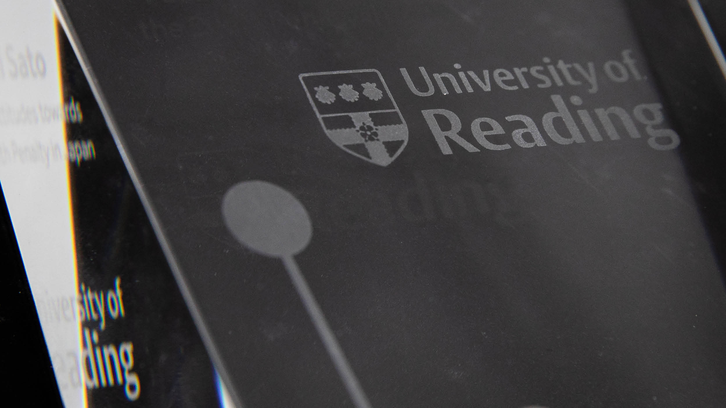 University of Reading logo engraved on a glass trophy
