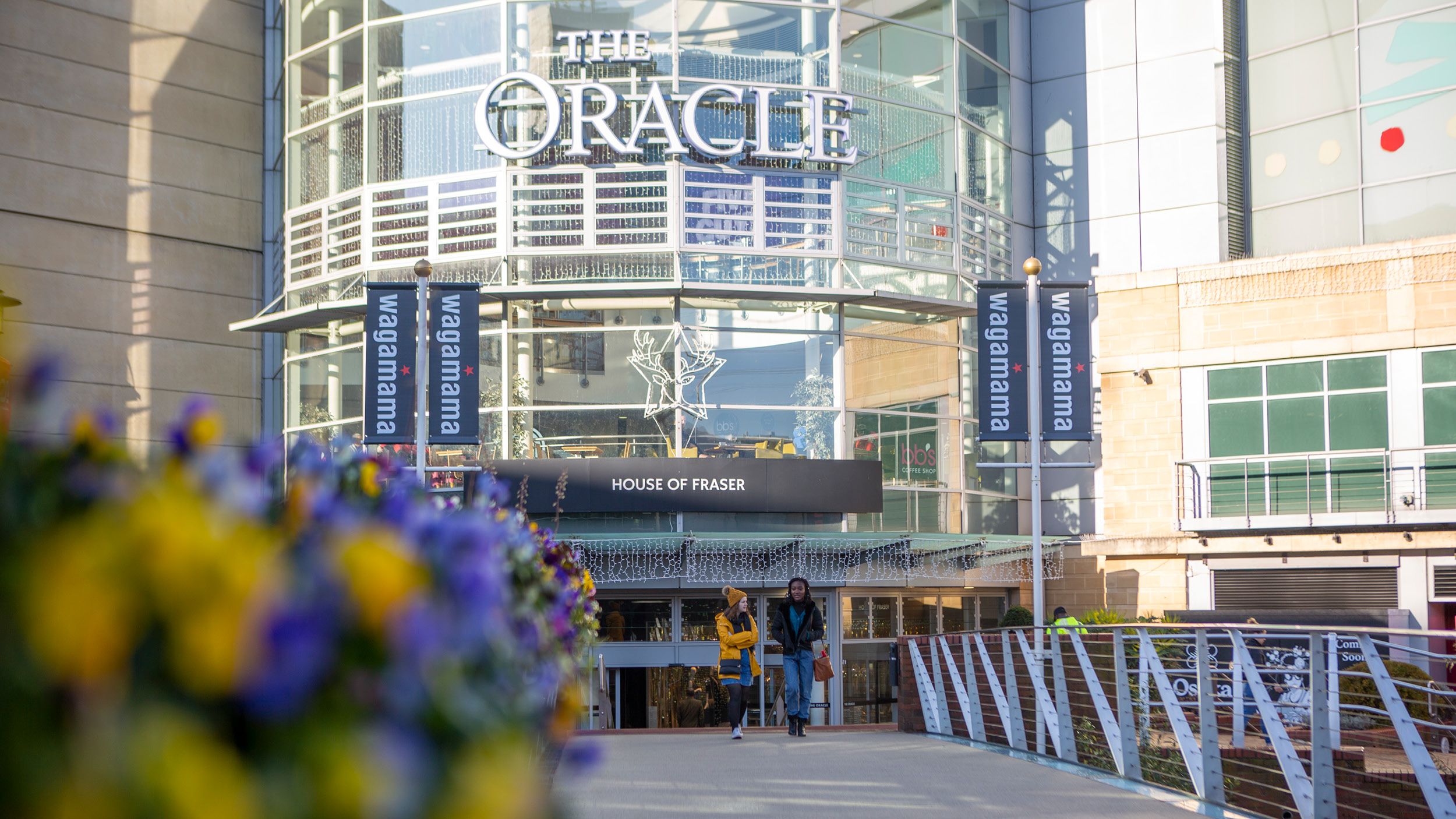 Two female students socialising at the Oracle Riverside shopping centre