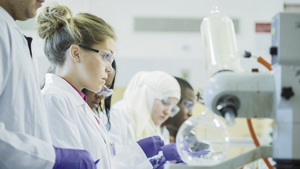 Group of students experimenting in a lab