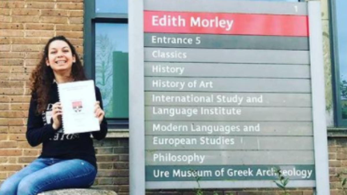 rebeca bird-lima with their dissertation outside the edith morley building