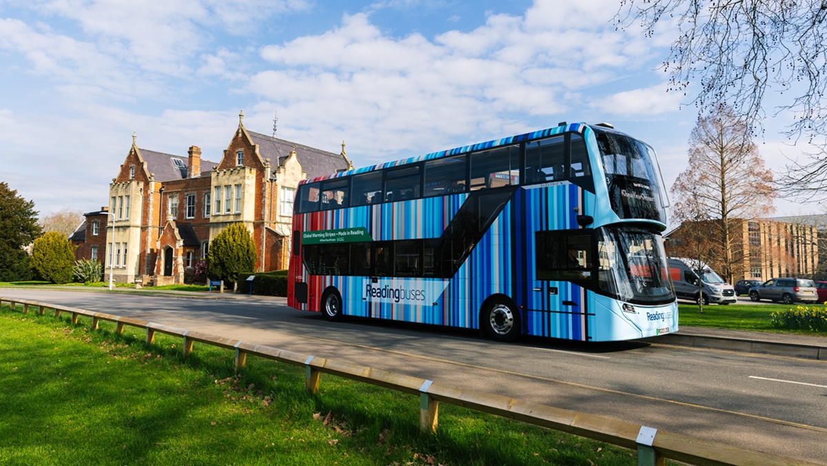 A Reading bus covered in the University of Reading climate stripe design
