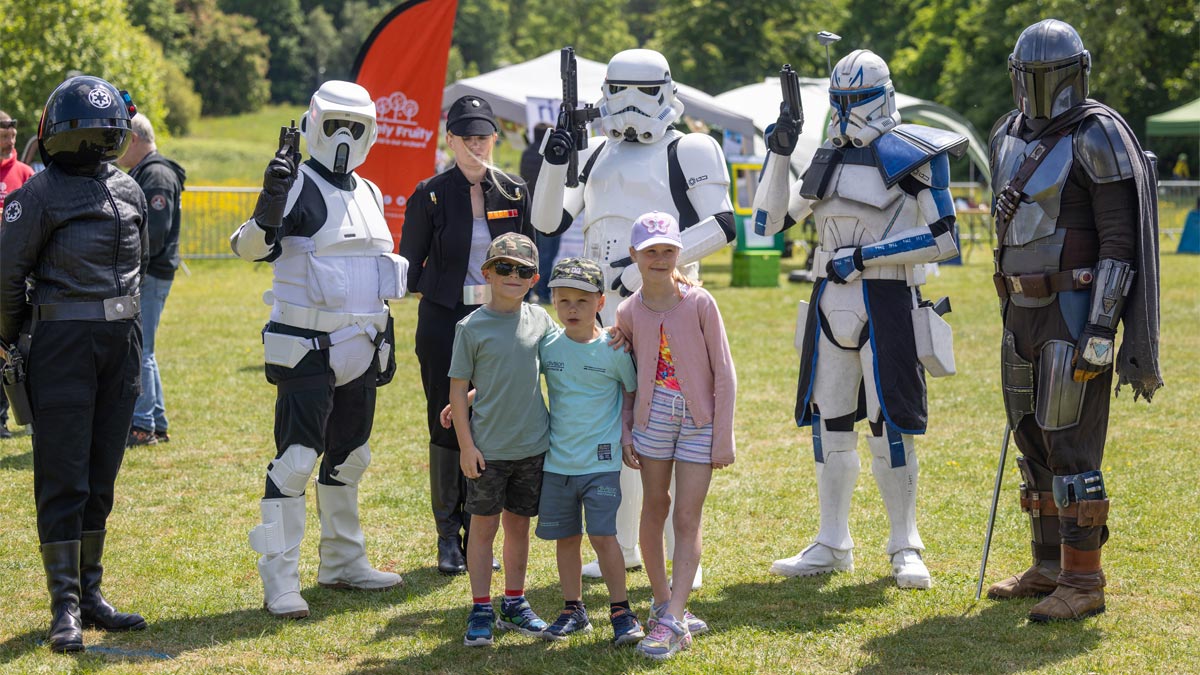 University of Reading's Community Festival 2025, three children stood in front of a group of stormtroopers and other intergalactic space marines.