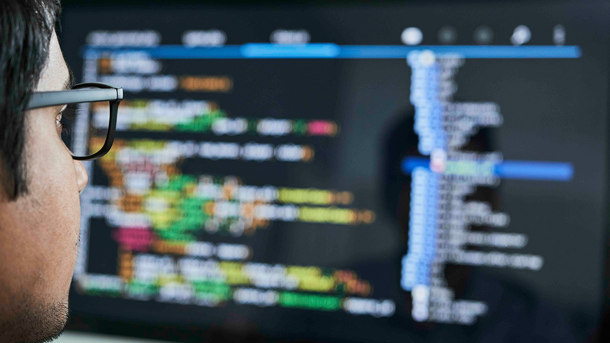 Student reviewing code on a computer screen