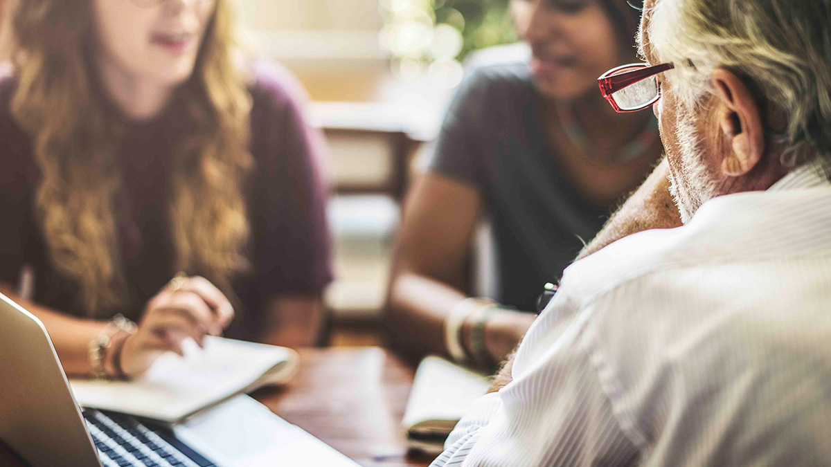 Professor talking to students