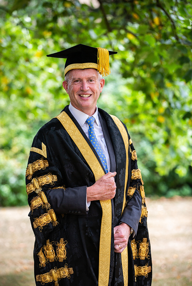Chancellor Paul Lindley OBE wearing the robes of office