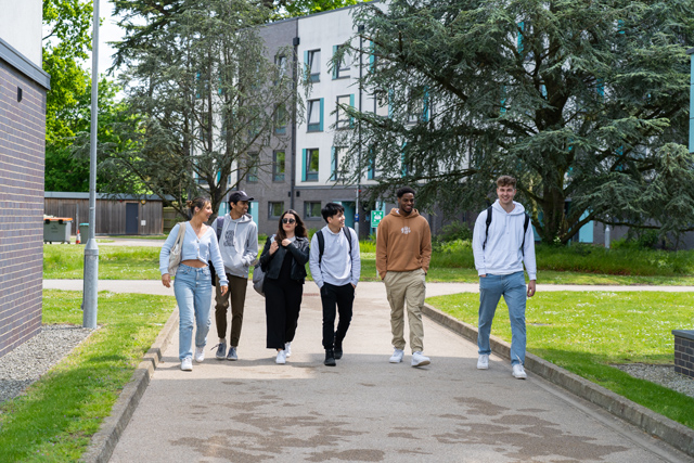 Group of students walking outside Bridges Halls