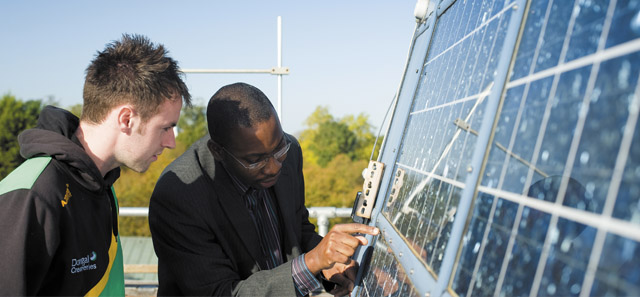 Tutor and student studying solar pannel