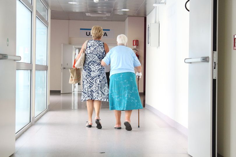Elderly patient in hospital corridor