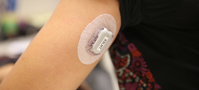 persons arm with blood monitor attached