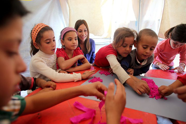 A group of children doing arts and crafts