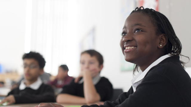 Happy, engaged children in a classroom environment