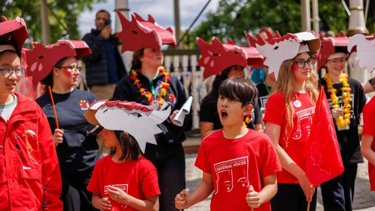 Universal voices children's choir performing in a parade
