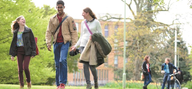 students walking across campus 