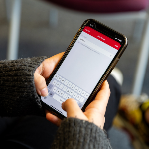 A student installing the CallMy app by adding the 'uoralert' group.