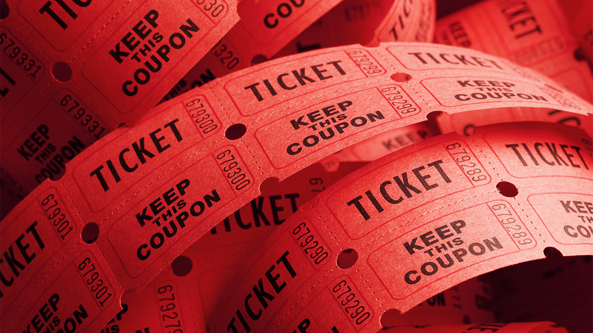 Close up of unwound red cinema or theatre coupons