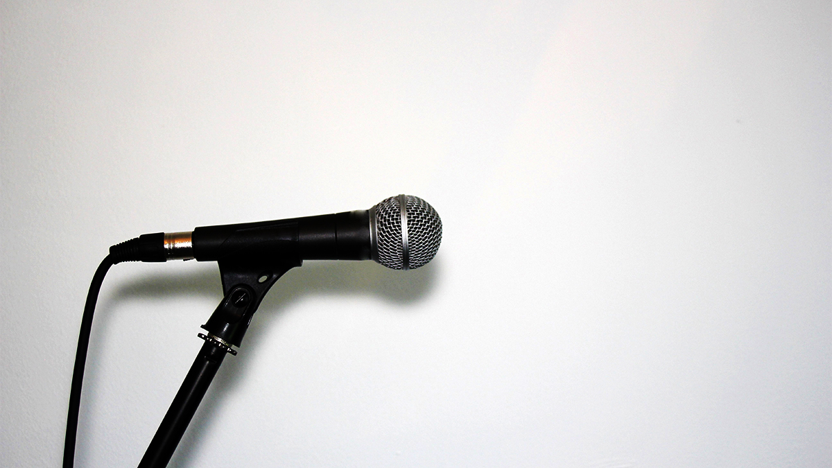 Microphone on a stand against a white background