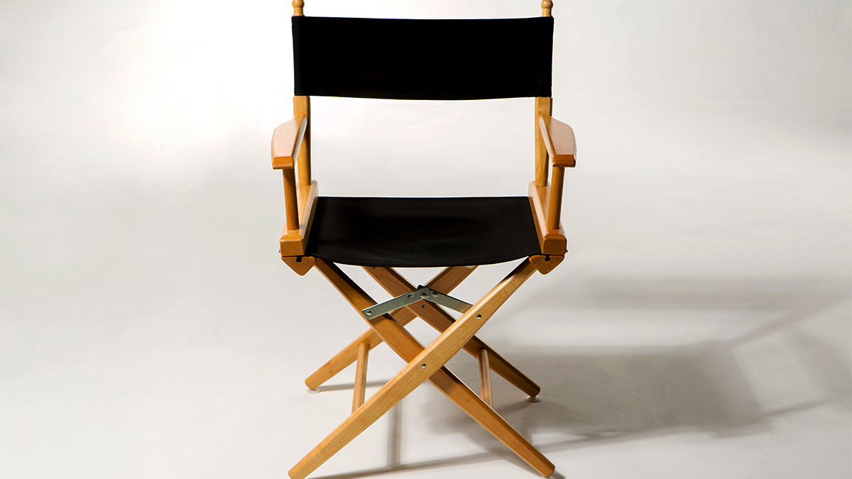 A director's chair against a white backdrop