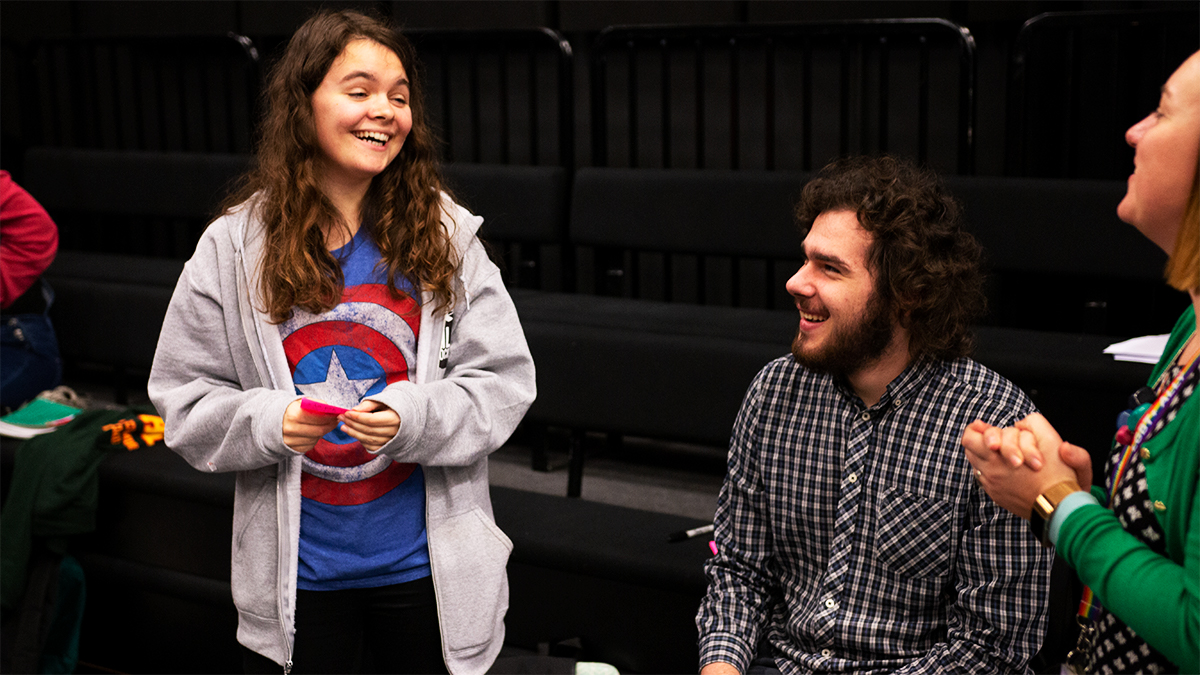 Three film and theatre students laughing together in Minghella Studios