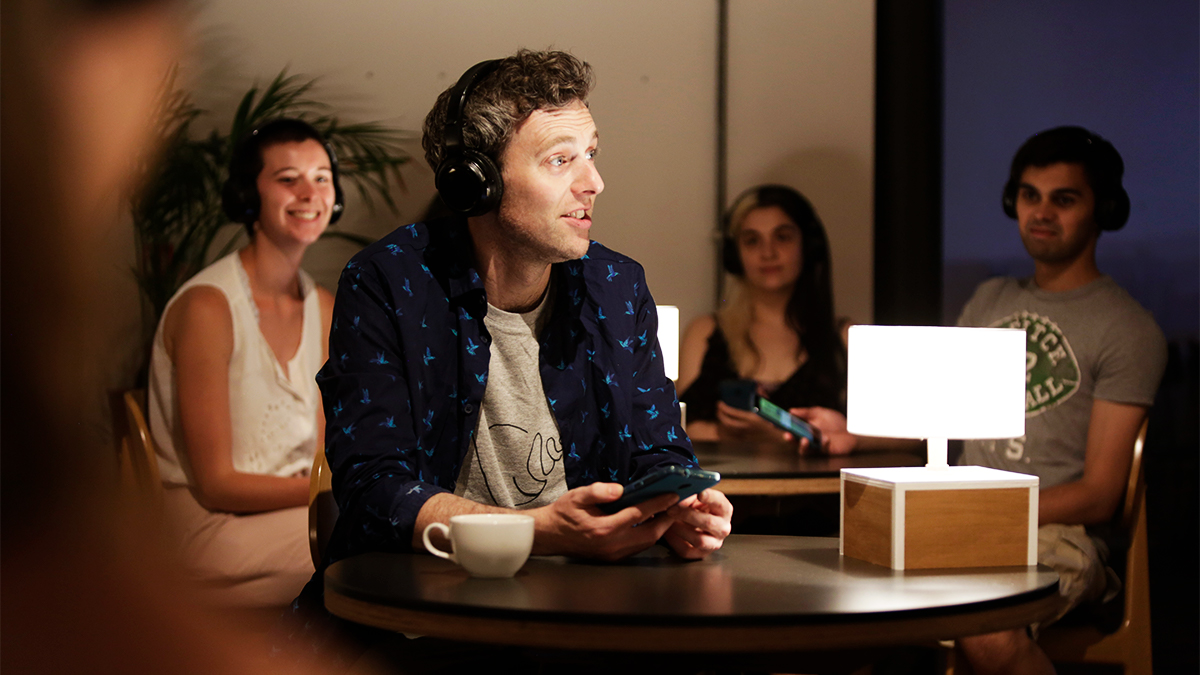 Man wearing headphones acting in User Not Found project performance