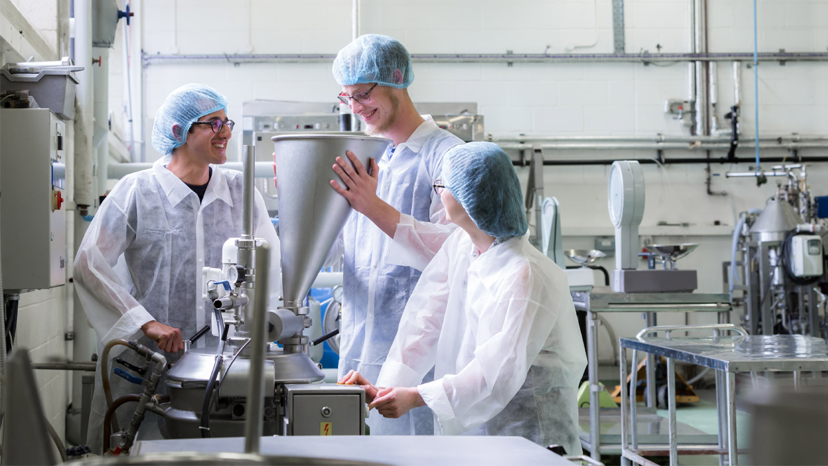 Three students in laboratory