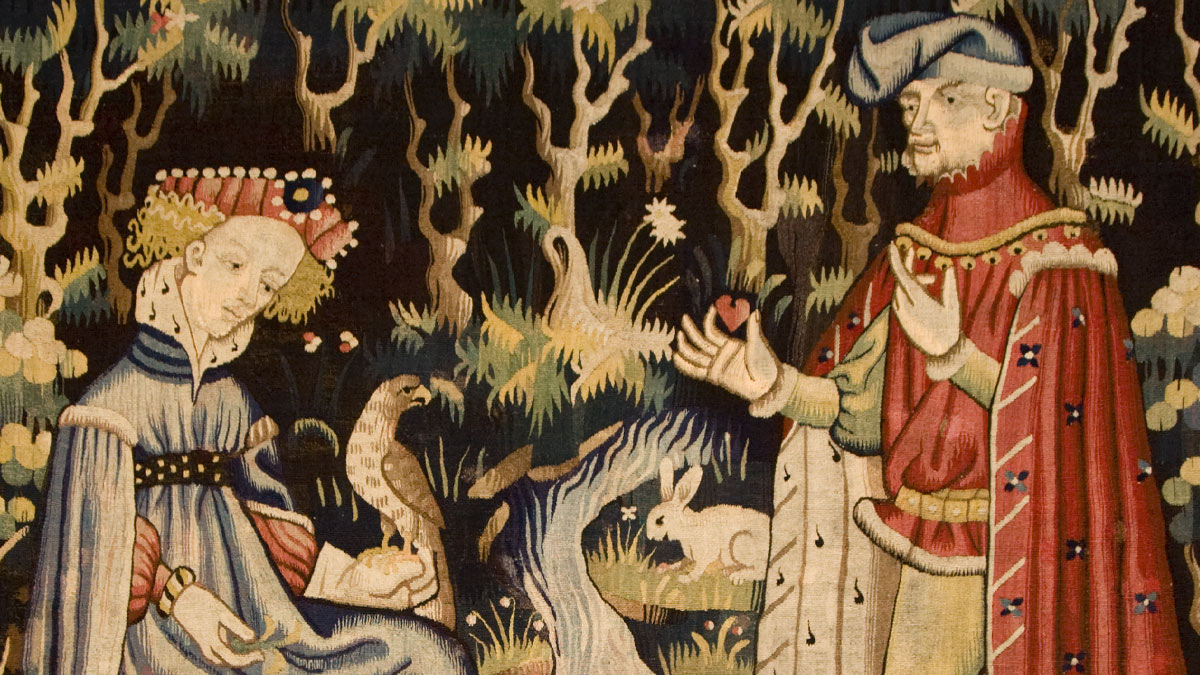 tapestry of a man and woman surrounded by woodland creatures