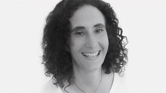 a black and white image of a smiling Professor Rebecca Rist