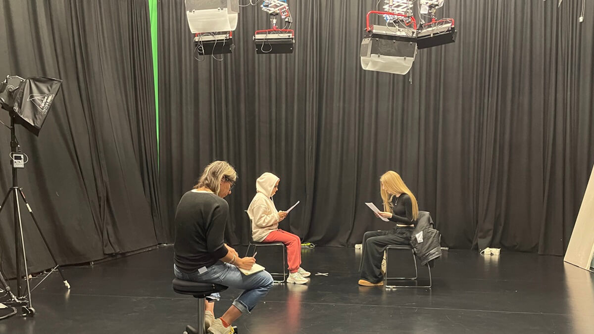 Staff and students rehearse the production of Glitch.