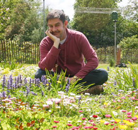Lionel Smith in a flower garden