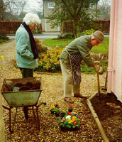 elderley couple gardening
