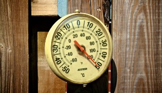 Outdoor thermometer showing temperature in excess of 50 degrees