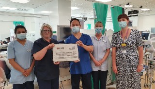 Staff at the Berkshire Kidney Unit receiving their plaque honouring the department with University status.