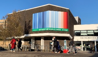 The climate stripes displayed on the wall of the Palmer Building on Whiteknights Campus, University of Reading