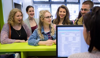Five students at a Help Desk
