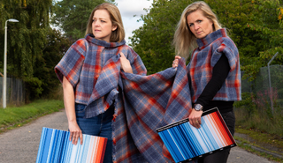 Alison White modelling news climate stripes tartan t-shirts. Image via Prickly Thistle. 